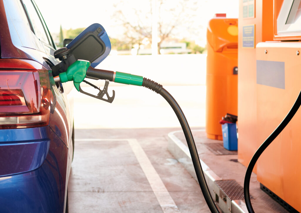 Gasoline hose connected to a car Fuel, gas station